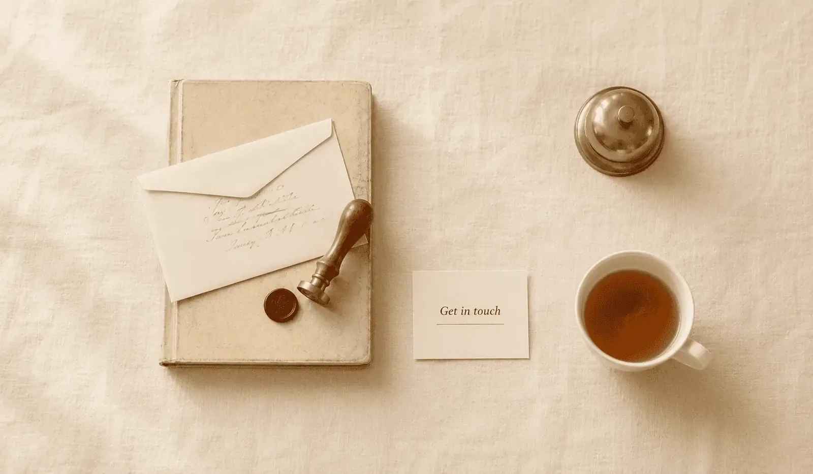 Editorial flat-lay of a vintage brass rotary telephone, leather correspondence folio, fountain pen and espresso on cream linen — contact Fast Tracking, anaesthetic billing services for Australian anaesthetists